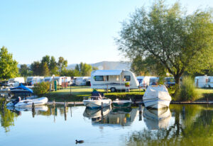 Camping site on a lake with RV's and Boats
